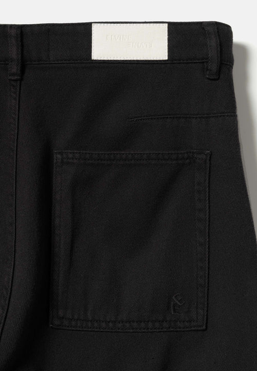 Garment-dyed tapered jeans black